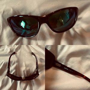 Brown frame sunglasses with reflective blue lenses